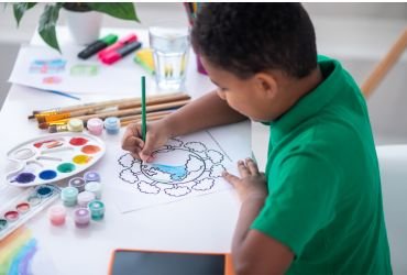 Child coloring a drawing